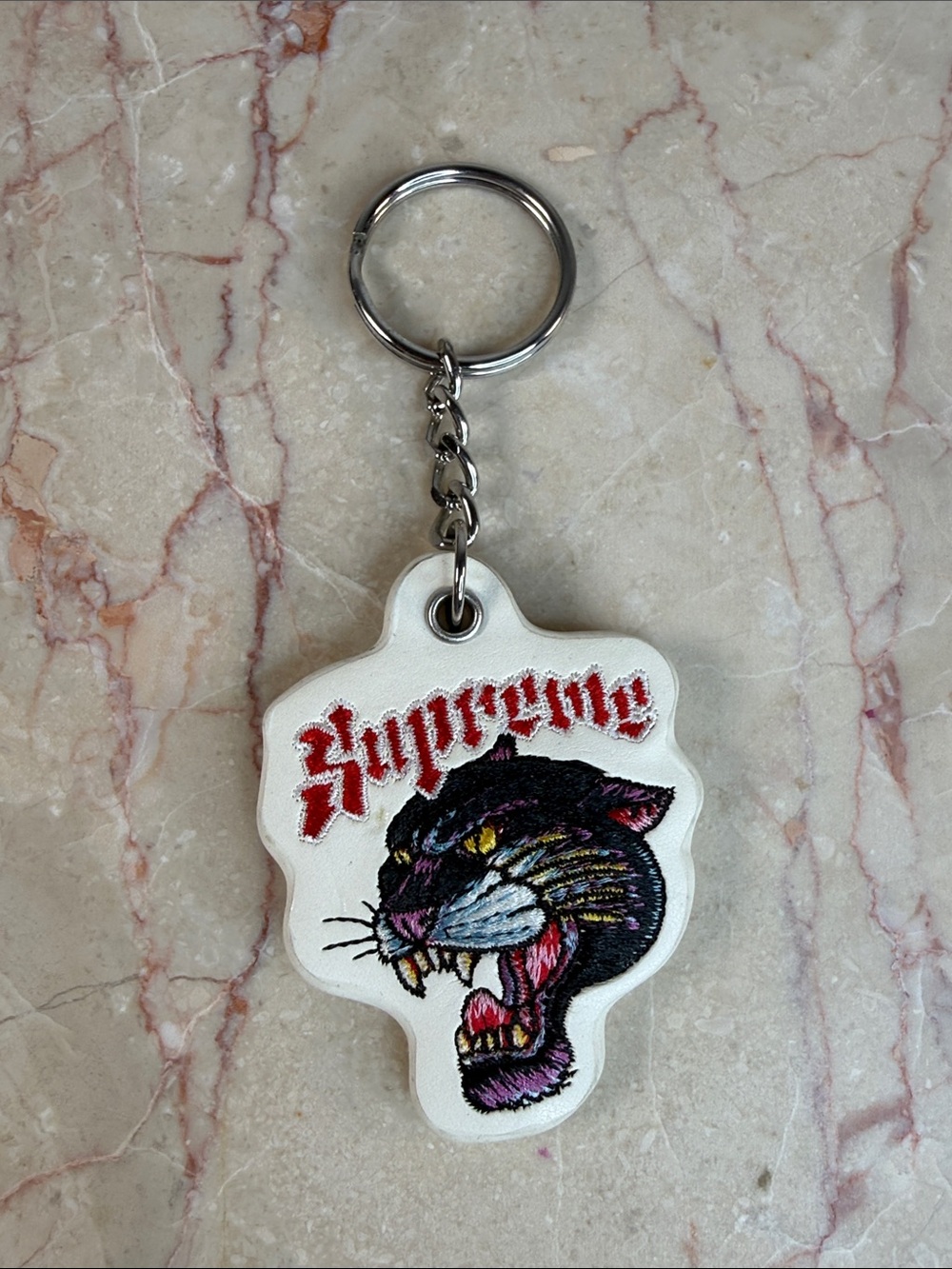 Supreme White Vegan Leather Keychain with Embroidered Black Panther
